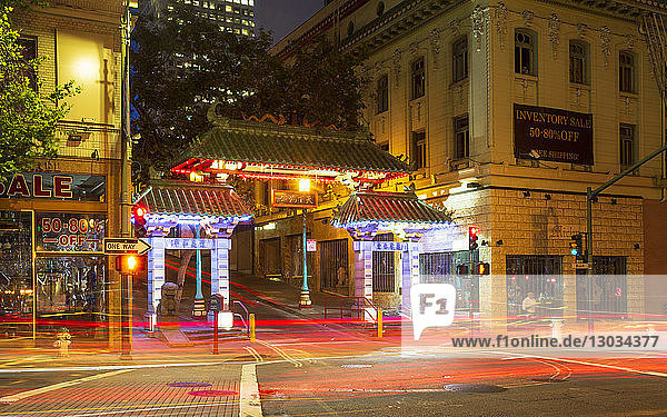 Dragon's Gate and car trail lights at night  Chinatown  San Francisco  California  United States of America  North America