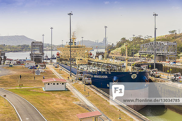 A ship passing through the Panama Canal at the Miraflores locks in Panama City  Panama  Central America