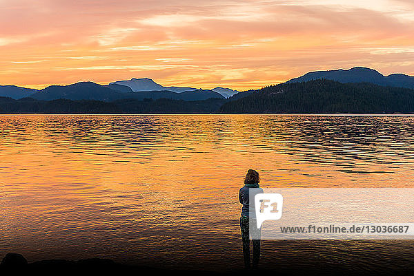 Young woman looking out at sunset  Quadra Island  Campbell River  Canada
