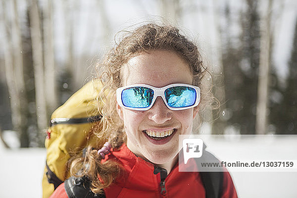 Woman smiles during a ski tour to Eiseman Hut  White River National Forest  Colorado.