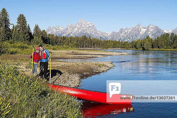 A mother and daughter canoeing the Snake River below the Grand Teton  Grand Teton National Park  Jackson  Wyoming  USA