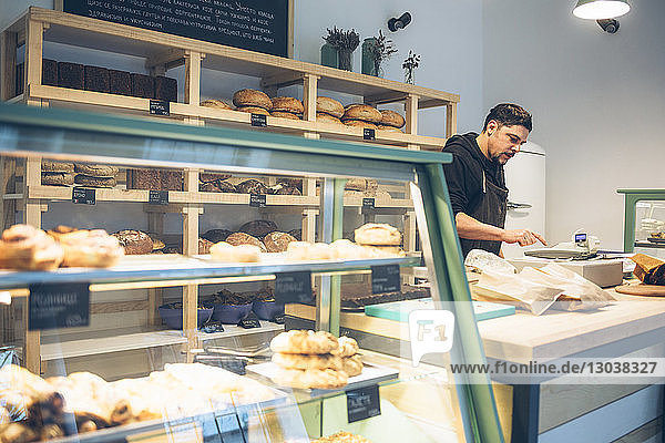 Male owner working at bakery