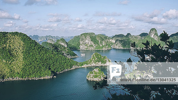 High angle view of Halong bay by mountains against sky