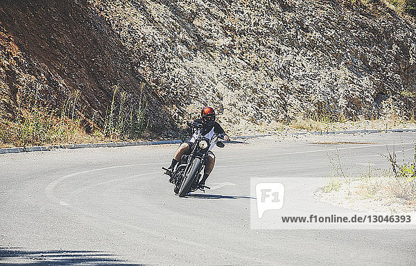 Man riding motorcycle on road