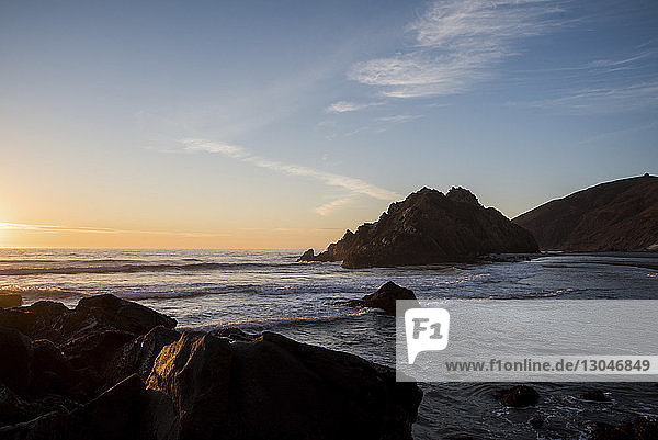 Scenic view of sea against sky during sunset