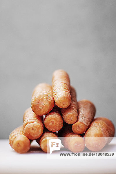 Stack of carrots on table