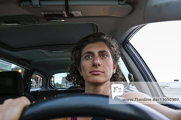Close-up of woman sitting at driver's seat