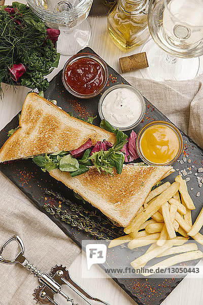 High angle view of sandwich and French Fries on table at restaurant