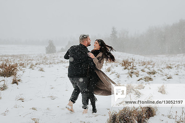 Couple dancing in snowy landscape  Georgetown  Canada
