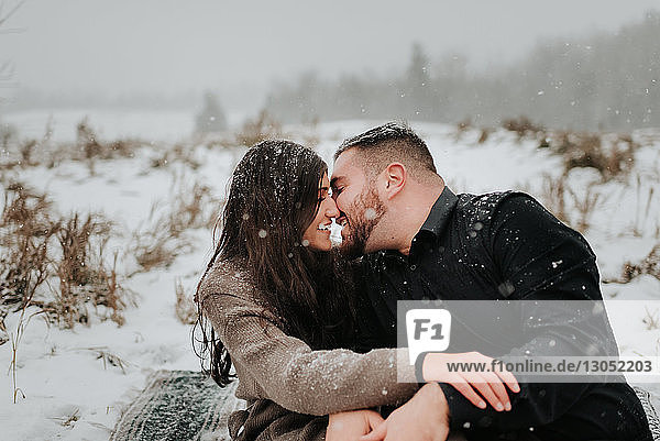 Couple kissing in snow  Georgetown  Canada