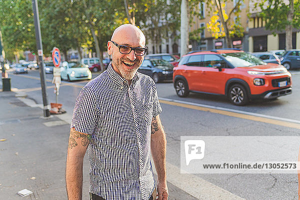 Happy mature man on city street  portrait
