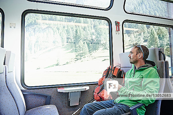 Hiker in train  Valais  Switzerland