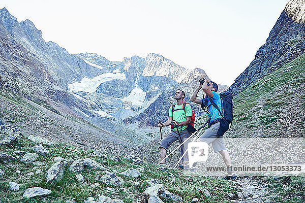 Hikers using binoculars  Mont Cervin  Matterhorn  Valais  Switzerland