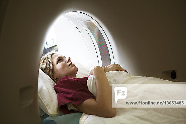 Woman lying in Mri scanner at hospital