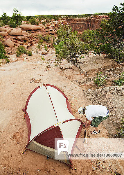 High angle view of man making tent