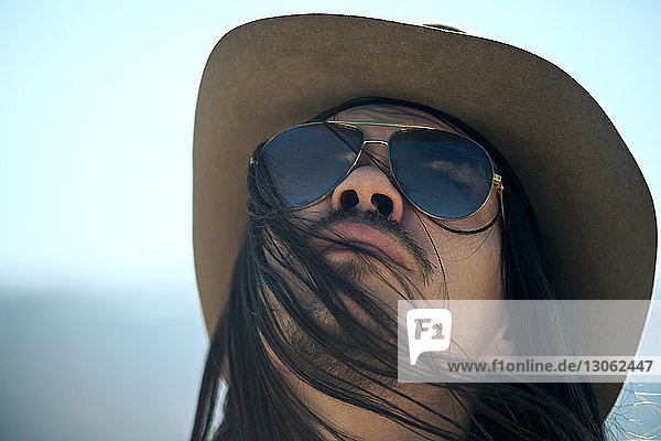 Low angle view of man with sunglasses