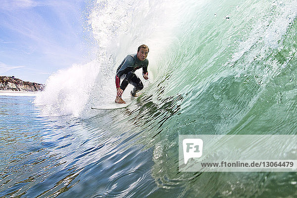 Man surfboarding at beach