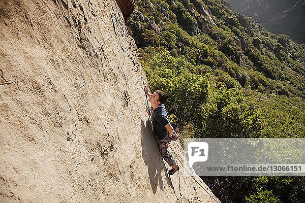 High angle view of man rock climbing