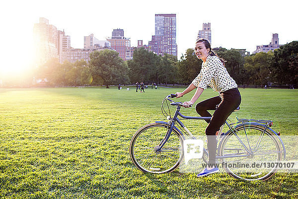 Side view of woman cycling in Central Park
