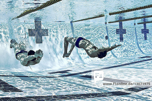 Athletes swimming in competition