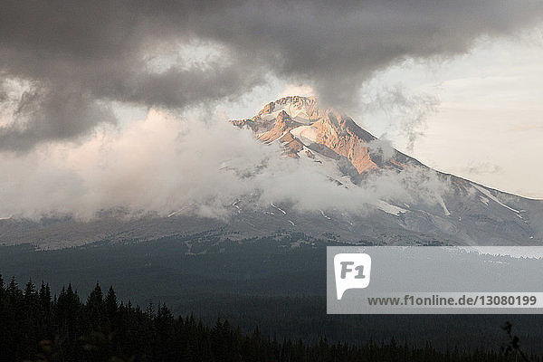 Scenic view of Mt Hood against cloudy sky