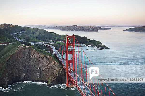 Aerial view of Golden Gate Bridge over San Francisco Bay against sky