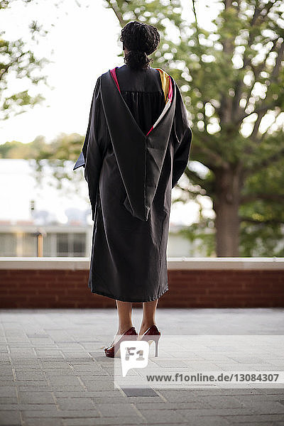 Rear view of woman in graduation gown