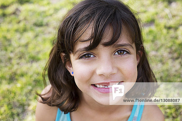 Close-up portrait of happy girl at park