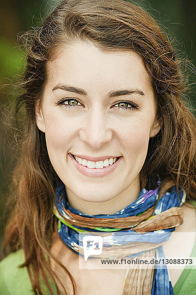Portrait of smiling woman wearing scarf