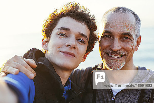 Close-up portrait of happy father and son