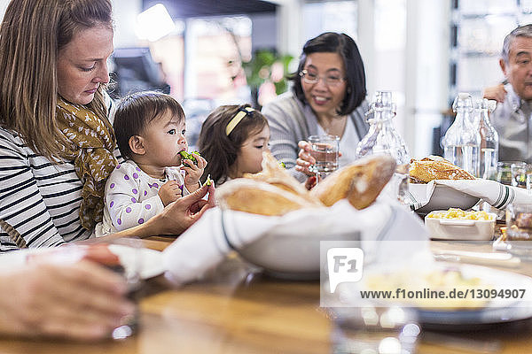 Family eating food in restaurant