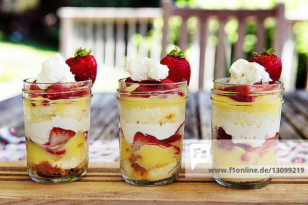 Strawberry parfaits on table runner