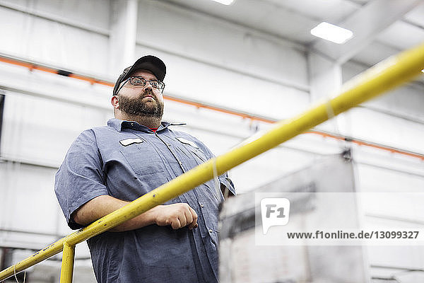 Low angle view of worker standing in Steel Industry Factory