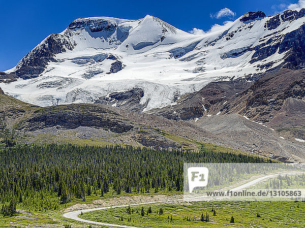Road winding through the rugged Canadian Rocky Mountains  Jasper National Park; Jasper  Alberta  Canada