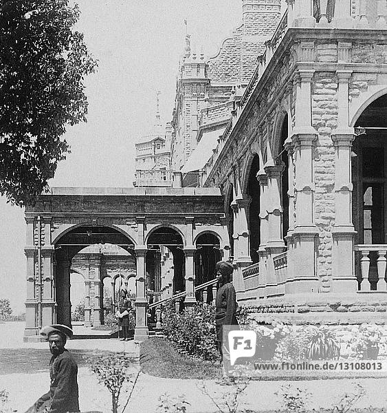 Vintage antique Victorian Stereoview card from circa 1900 India through the stereoscope.1903 historic social history images South front of Viceregal Lodge Palace of Viceroy at Sinja the summer capital of India. A handsome building is this and a great deal more (t is the home of George Nathaniel Curzon Lord Kedleston the ruler of India. Seeing the place with our own eyes we understand the picturesque phrases of a recent writer on the Indian Viceroy: “ On the top of a Himalayan hill looking one way across the plain of the brimming Sutlej and the other orer shouldering ridges to the snows sits George Nathaniel Lord Curzon of Kedleston. governing the great India which spreads at his feet under his eyes two thousand flat mites to the south. Here he sits one of the Empire's ‘ coming men ’ known and proved at home anxious to be known and proved abroad to rise upon the things he will do to leave his mark upon the time. Lord Curzon’s is a moving virile figure upon the open page of our history; it commands our interest and invites our criticism.
