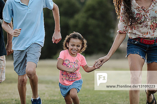 Playful family running at park