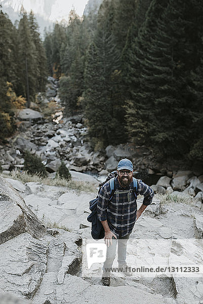 High angle portrait of man standing on mountain at Yosemite National Park