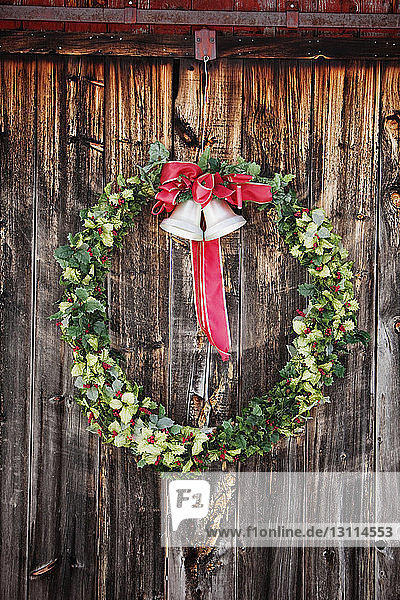 Wreath on snow covered barn during Christmas
