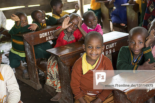 Children sitting at desks in school