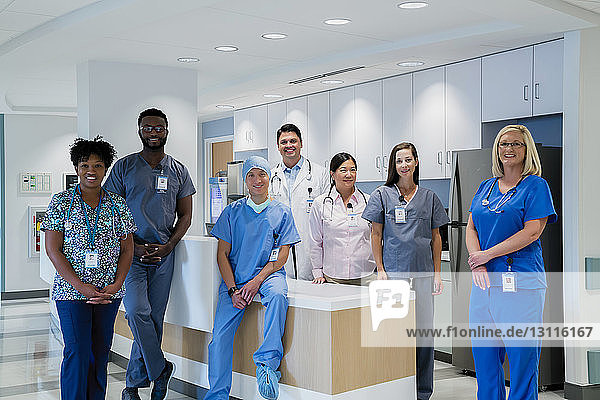 Portrait of smiling doctors and nurses at hospital reception