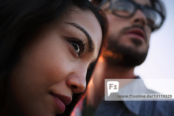 Close-up of couple looking away