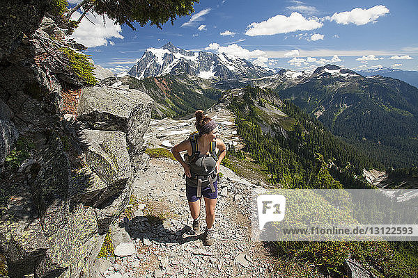 Female hiker walking on mountain at North Cascades National Park
