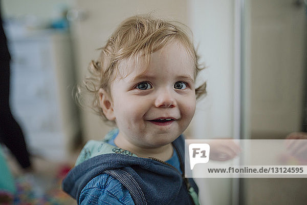 Portrait of cute baby boy at home