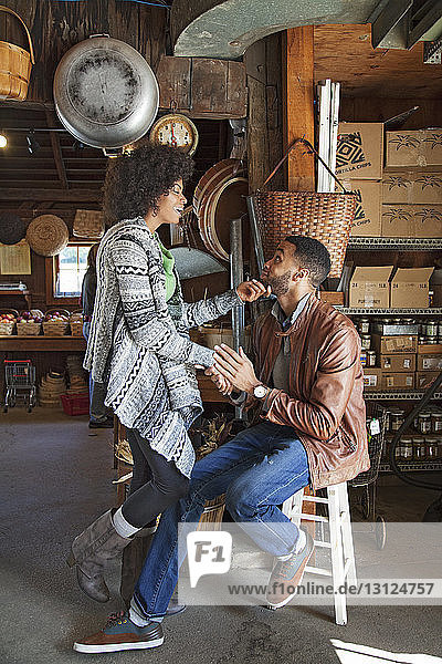 Cheerful couple enjoying in organic shop