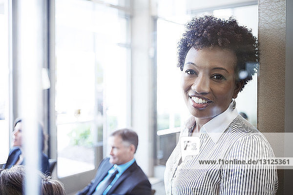 Portrait of businesswoman standing in conference room