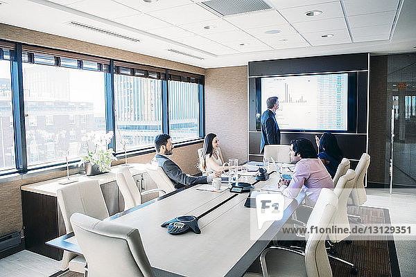 Entrepreneurs brainstorming in meeting at conference room