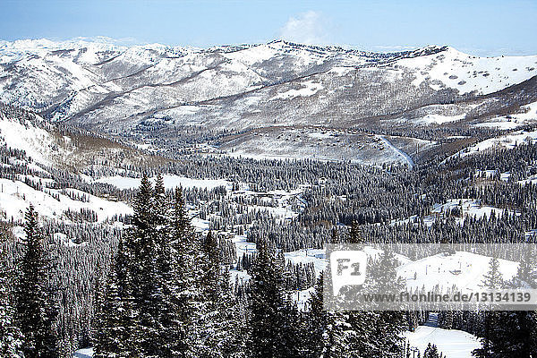 Scenic view of snow covered valley and mountains