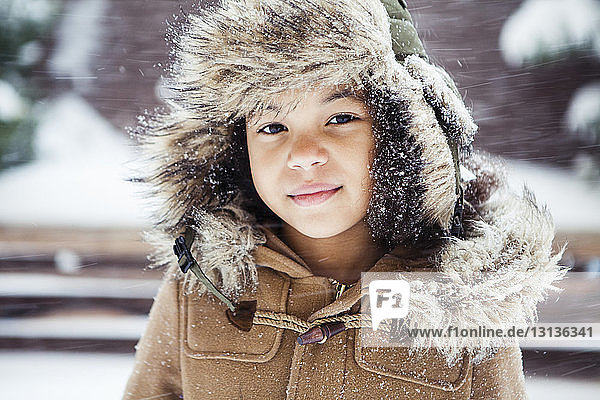 Portrait of confident girl wearing warm clothing during winter