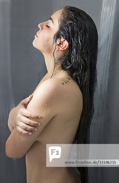 young woman under shower