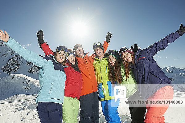Friends smiling with arms raised  Kuhtai  Austria